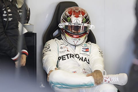 Mercedes driver Lewis Hamilton, of Britain, sits in his garage. (Photo | AP)