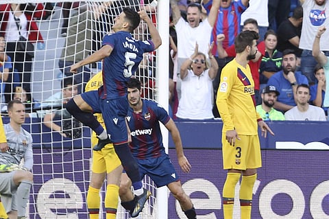 Levante's Nemanja Radoja celebrates after scoring his side third goal against Barcelona (Photo | AP)