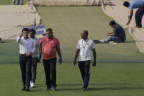 Sourav Ganguly, left, inspects the ground with other officials. (Photo | AP)