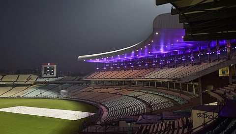 A portion of a stadium is seen illuminated with lights ahead of the first pink ball day-night Test match between India and Bangladesh at Eden Garden in Kolkata. (Photo | PTI)