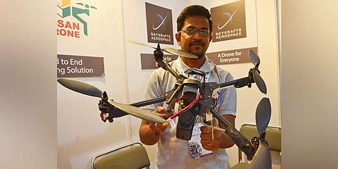 A visitor holds a drone at Bengaluru Tech Summit at Bangalore Palace on Wednesday | Shriram BN