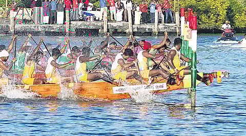 Tropical Titans winning the first Champions Boat League Trophy by coming first in a photo-finish at the 12th and final round of CBL at Ashtamudi Lake in Kollam on Saturday | express