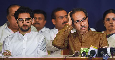 Shiv Sena Chief Uddhav Thackeray with son and Yuva Sena chief Aaditya Thackeray during a joint press conference. (Photo| PTI)