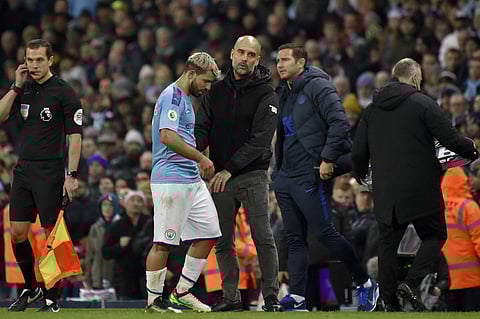 Manchester City's head coach Pep Guardiola talks with Sergio Aguero. (Photo | AP)