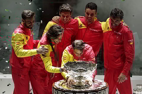 Spain's Rafael Nadal, center, and his teammates seen taking a close look at the Davis Cup trophy. (File Photo | AP)