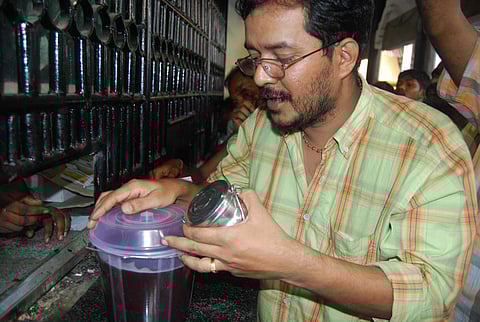 Aravana Prasadam being distributed in plastic carry bags brought by the pilgrims at a special counter at the Sannidhanam. (File Photo | EPS)