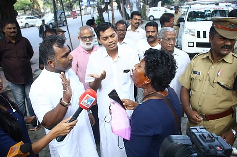 Activist Bindu Ammini arguing with AHP national secretary Pratheesh Viswanath and BJP leader CG Rajagopal at Kochi Police Commissioner office on Tuesday morning. (Photo | EPS)