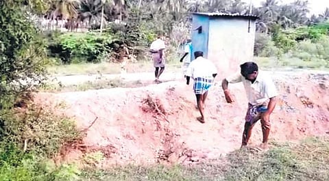 Dalit communit members say caste Hindus have dug a trench on the path leading to the burial ground to prevent them from using the stretch.