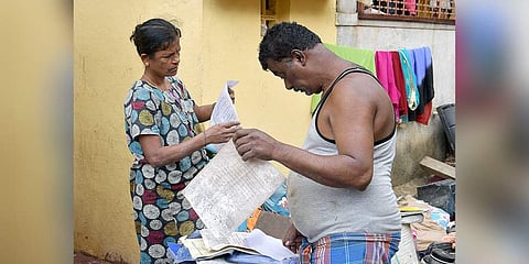 Residents dry out their documents and belongings on Monday. (Photo | Express)