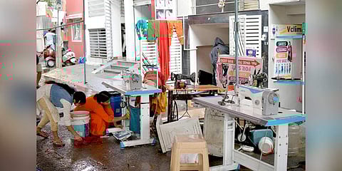 Lavanya cleans up her sewing machine. (Photo | Express)