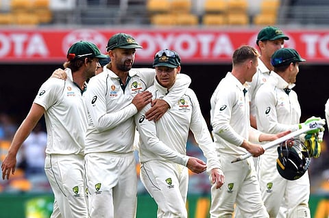 Australia's team celebrate their victory at the end of the first Test cricket match against Pakistan at the Gabba in Brisbane. (Photo | AFP)
