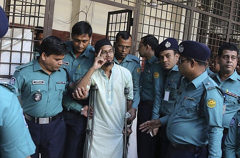 Police escort a member of a banned militant group after he was sentenced to death for an attack on a Dhaka cafe that killed more than 20 people in Dhaka, Bangladesh, Wednesday, Nov. 27, 2019. (Photo | AP)