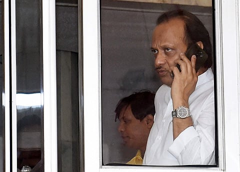 NCP leader Ajit Pawar talks over the phone as he arrives at Maharashtra Vidhan Bhawan in Mumbai Wednesday Nov. 27 2019. (Photo | PTI)