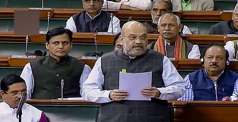 Union Minister Home Shah speaks in the Lok Sabha during the Winter Session of Parliament in New Delhi. (Photo | PTI)