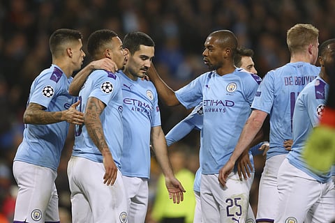 Manchester City players celebrate with Ilkay Gundogan (C) after he scored against Shakhtar Donetsk. (Photo | AP)