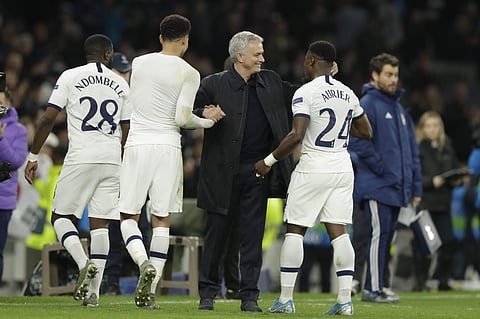 Tottenham manager Jose Mourinho hugs Dele Alli and Serge Aurier at the end of the Champions League match against Olympiakos. (Photo | AP)