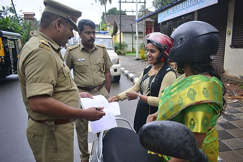 Motor Vehicles Department officials checking documents of two-wheeler passengers. (File Photo | Manu R Mavelil, EPS)