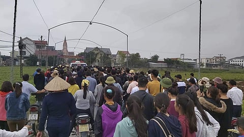 Local villagers follows ambulances carrying the bodies of Nguyen Van Hung and Hoang Van Tiep, two of the 39 people found dead in a truck in England, to their home village, Dien Chau district of Vietnam. (Photo | AP)