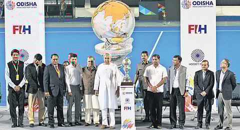 Odisha CM Naveen Patnaik (c) unveils the 2023 World Cup trophy at Kalinga Stadium in Bhubaneswar on Wednesday | IRFANA