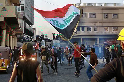Anti-government protesters gather on Rasheed Street during clashes with security forces in Baghdad, Iraq, Thursday, Nov. 28, 2019. Scores of protesters have been shot dead in the last 24 hours, amid spiraling violence in Baghdad and southern Iraq, officia