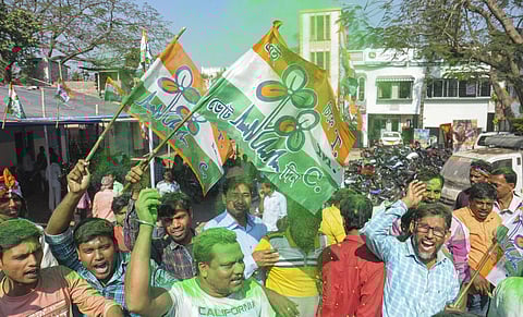 Trinamool Congress supporters celebrate after party's victory in the Karimpur assembly seat by-poll in Nadia. (Photo | PTI)