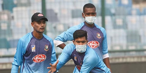Bangladesh cricket team members wear masks to protect themselves from air pollution as they practice at the nets ahead of their first T20 international cricket match against India in New Delhi. (Photo | AP)