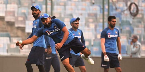 Indian cricketer Rohit Sharma attempts to take a catch during a practice session ahead of their first T20 international cricket match against Bangladesh in New Delhi. (Photo | AP)