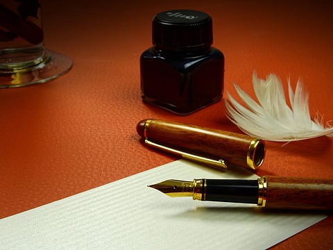 Image of fountain pen and ink used for representational purpose
