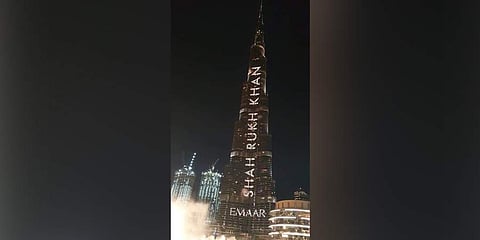 Dubai's iconic skyscraper Burj Khalifa lit up with Bollywood actor Shah Rukh Khan's name to mark his 54th birthday on 2 November 2019. (Photo | Twitter)