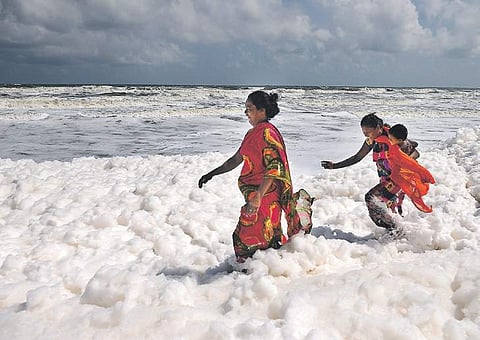 Not aware of the potential harm, visitors at Pattanipakkam beach enjoying themselves amidst a thick blanket of froth on Friday | DEBADATTA MALLICK