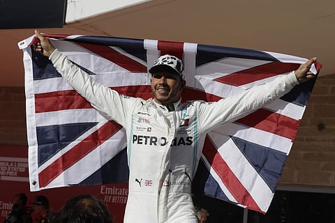 Mercedes driver Lewis Hamilton, of Britain, celebrates after the Formula One U.S. Grand Prix. (Photo | AP)