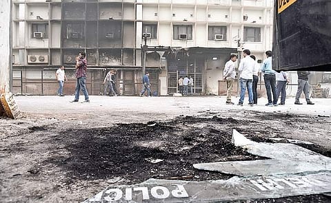 People inside the Tis Hazari court complex on Sunday, a day after a clash between police personnel and advocates in which vehicles were set on fire. (Photo | EPS, Parveen Negi)