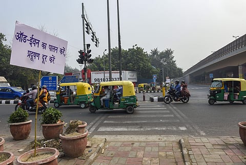 A placard asking people to obey the odd-even rules is seen fixed in flower-pot at ITO in New Delhi Monday Nov. 4 2019. | (Photo | PTI)