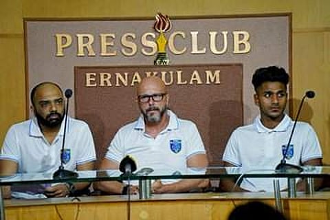 Kerala Blasters CEO Viren D’Silva (L) with coach Eelco Schattorie (C). (Photo | Twitter/ Kerala Blasters)