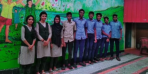 NSS volunteers outside the anganwadi compound wall