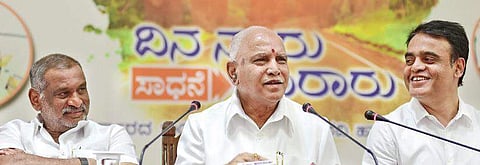 Chief Minister B S Yediyurappa with his deputy Dr C N Ashwath Narayan (R) and Law Minister J C Madhuswamy (L), in Bengaluru on Tuesday I VINOD KUMAR T