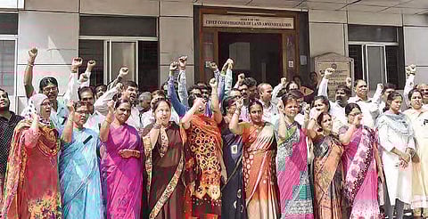 TRESA employees stage protest on Tuesday at the office of chief commissioner of land administration against the brutal killing of Vijaya Reddy (