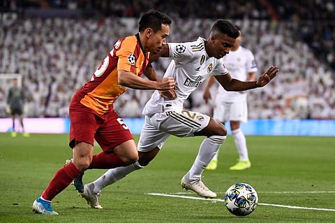 Galatasaray's Japanese defender Yuto Nagatomo (L) challenges Real Madrid's Brazilian forward Rodrygo (R) during the UEFA Champions League Group A football match. (Photo | AFP)