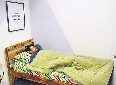 An employee of RentoMojo takes a nap at the office Pandarinath B