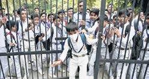 Students leave wearing masks as schools reopened. (Photo | EPS, Parveen Negi)
