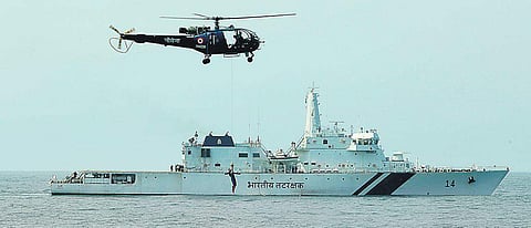 A Navy Chetak helicopter winching up a serviceman, as part of displaying the force’s operational readiness, off Kochi on Wednesday Pics: Arun Angela
