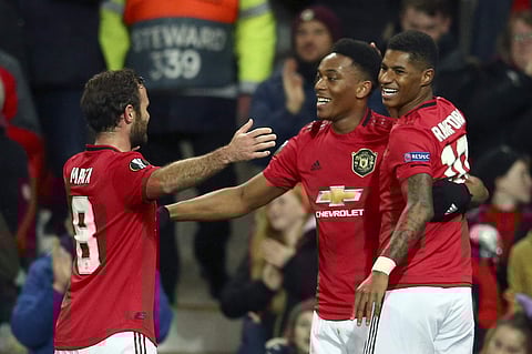 Manchester United's Anthony Martial, center, celebrates with Juan Mata and Marcus Rashford, right, after scoring his side's second goal. (Photo | AP)