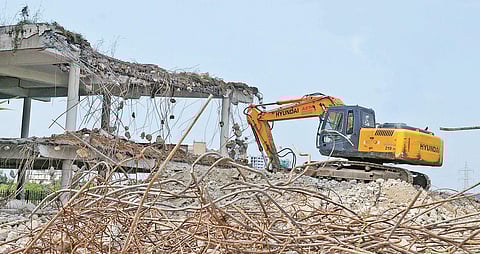 Parking lot of Jains Coral Cove, among the five whose razing was ordered by the SC, being demolished by workers | A Sanesh
