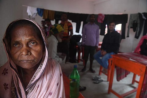 Villagers wait in a shelter after the ferry service to Sagar Island was suspended due to the approaching Cyclone Bulbul in Kakdwip in West Bengal state on November 9, 2019. Cyclone Bulbul, packing a maximum wind speed of 120 kilometres per hour (75 miles)