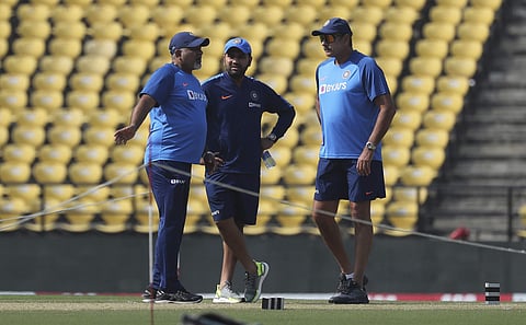 Indian cricket team coach Ravi Shastri, right, speaks with captain Rohit Sharma, center and bowling coach Bharat Arun. (Photo | AP)