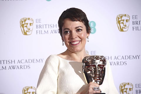 Actress Olivia Colman poses backstage with her Best Actress award for her role in the film 'The Favourite'. (AP photo)