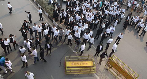 Lawyers shout slogans against Delhi Police during a protest as they block a road outiside Tis Hazari Court in New Delhi on Monday. | (Photo | Arun Kumar/EPS)