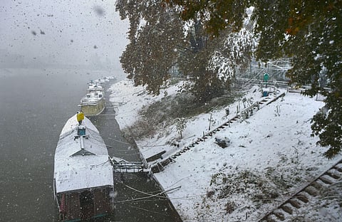 Houseboats stand docked during heavy snowfall in Srinagar Thursday Nov. 7 2019. | (Photo | PTI)