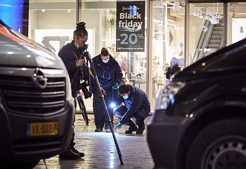 Forensic experts look for clues on the scene of a stabbing incident in the center of The Hague, Netherlands, Friday, Nov. 29, 2019. Dutch police say multiple people have been injured in a stabbing incident in The Hague's main shopping street. (Photo | AP)