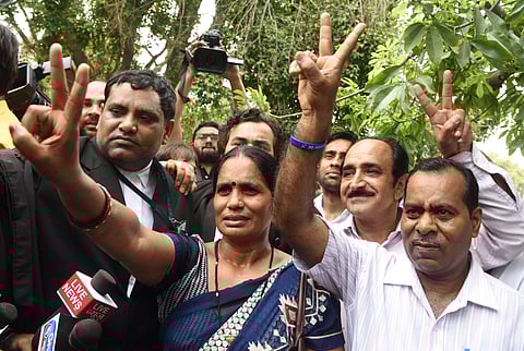 Nirbhaya's parents show victory sign after the Supreme Court's verdict on Dec 2012 gang rape case in New Delhi on Monday July 9 2018. (File | EPS)
